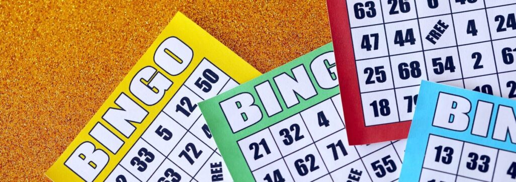 Many colorful bingo boards or playing cards for winning chips